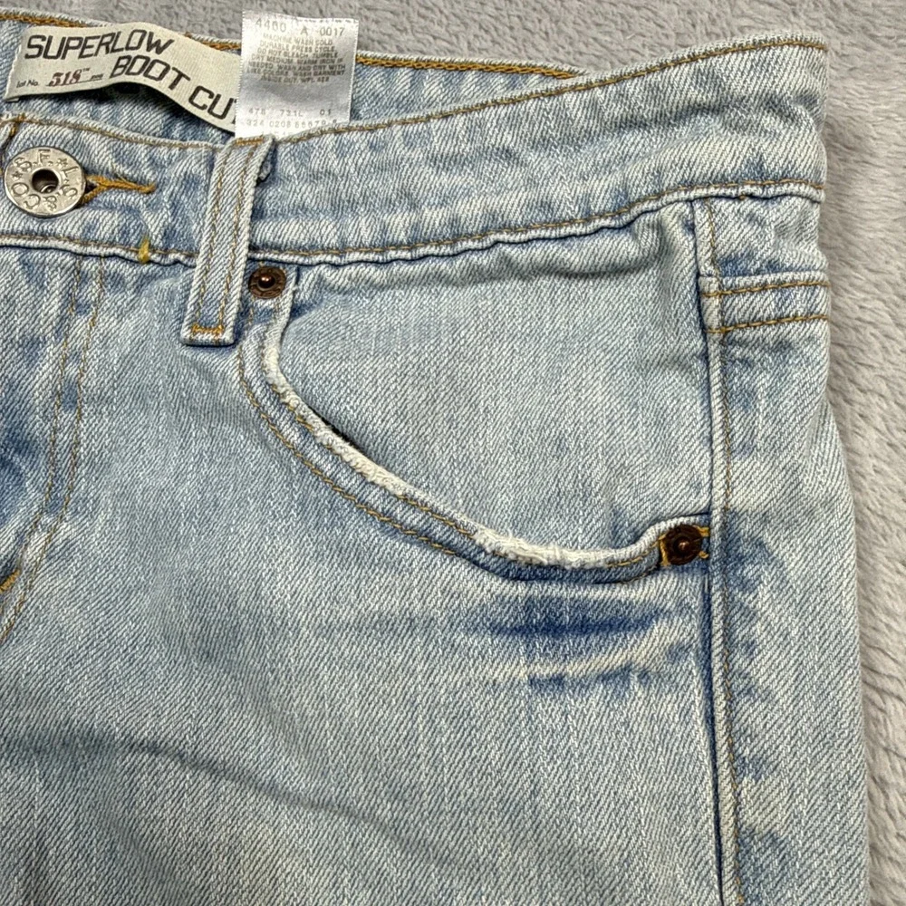 Vintage Levi's 518 Superlow Bootcut Jeans 31x31 Blue Light Wash Low Rise Stained